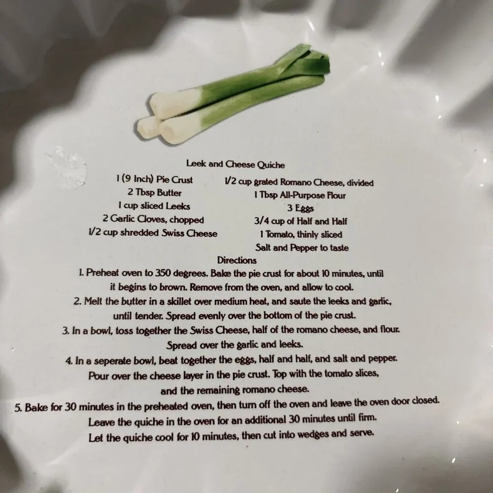 This is a vintage white ceramic quiche or flan baking dish